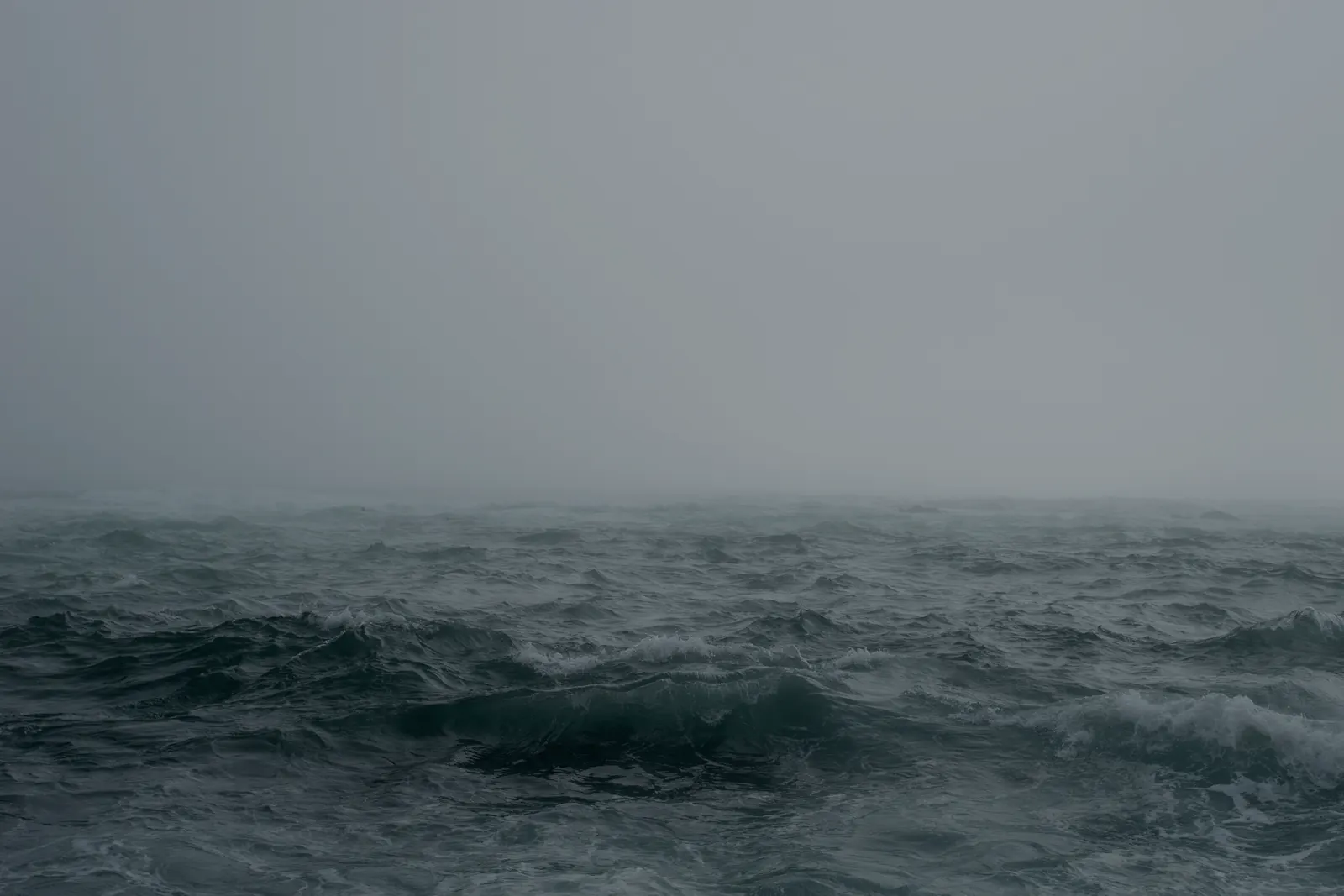Storm swell in mist on the open ocean